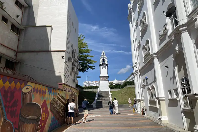 The Ultimate Guide To The 10 Best Day Trips from Kuala Lumpur (Local Expert Edition) 5 Visitors walking toward the Birch Memorial Clock Tower in Ipoh during a day trip from Kuala Lumpur.